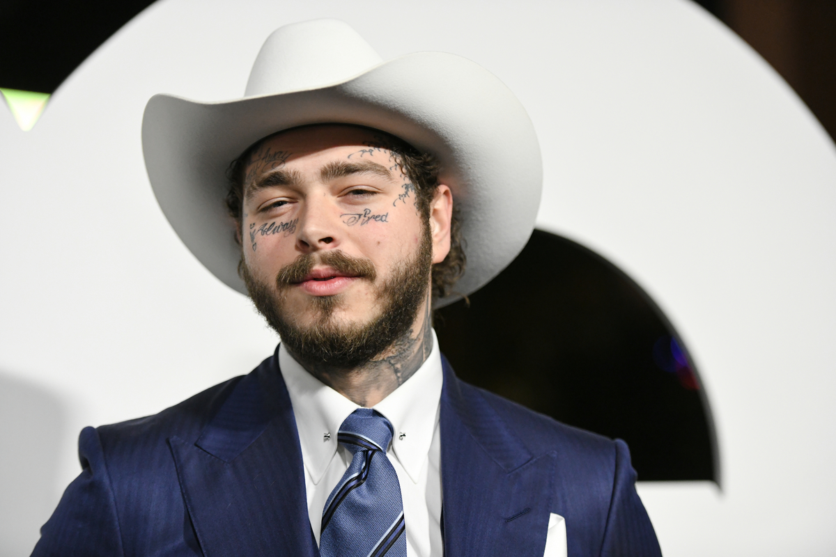 Wearing a cowboy hat Post Malone attends the GQ Men of the Year Awards in West Hollywood, CA. 