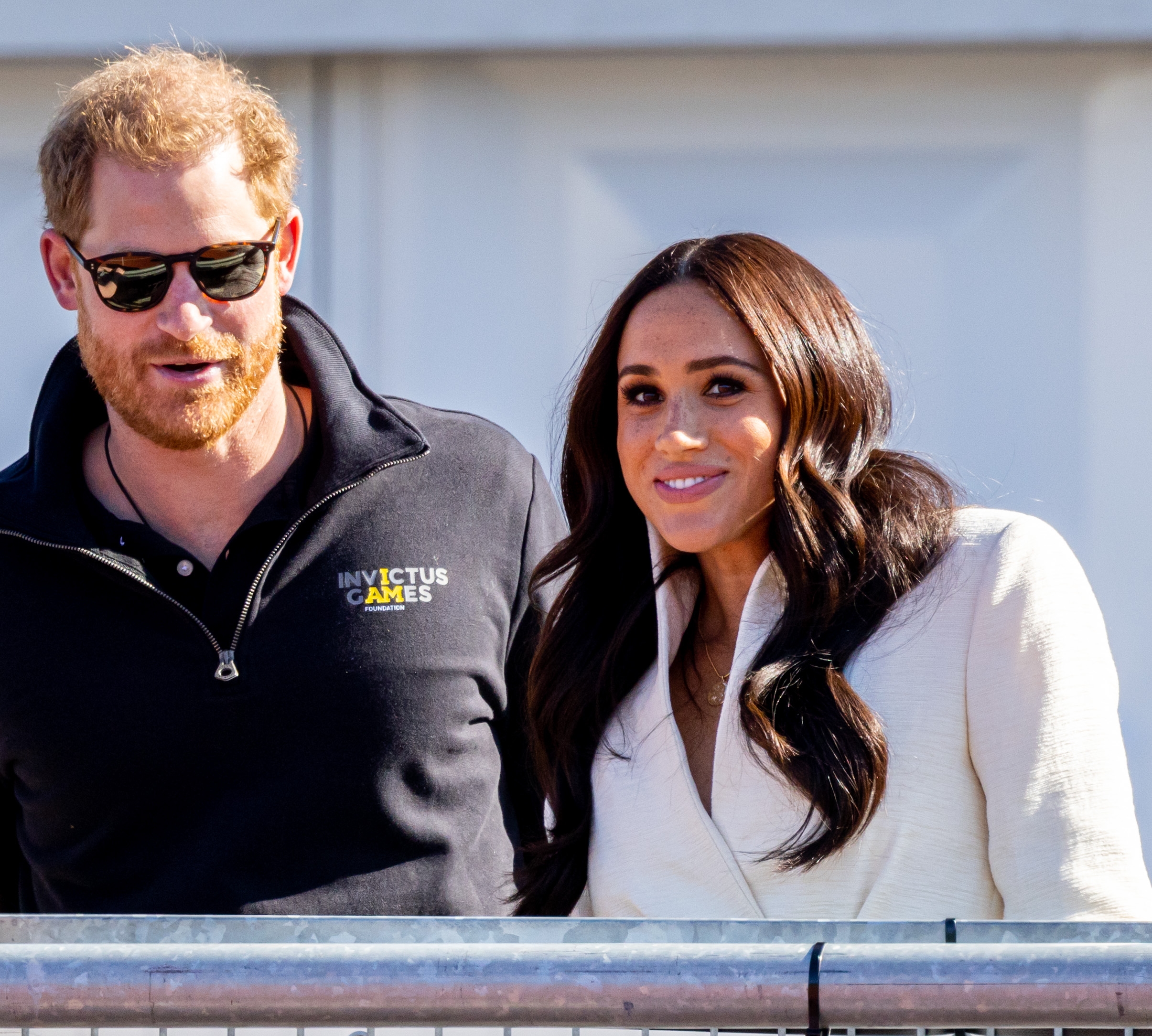 Prince Harry and Meghan Markle smiling during the Invictus Games at Zuiderpark