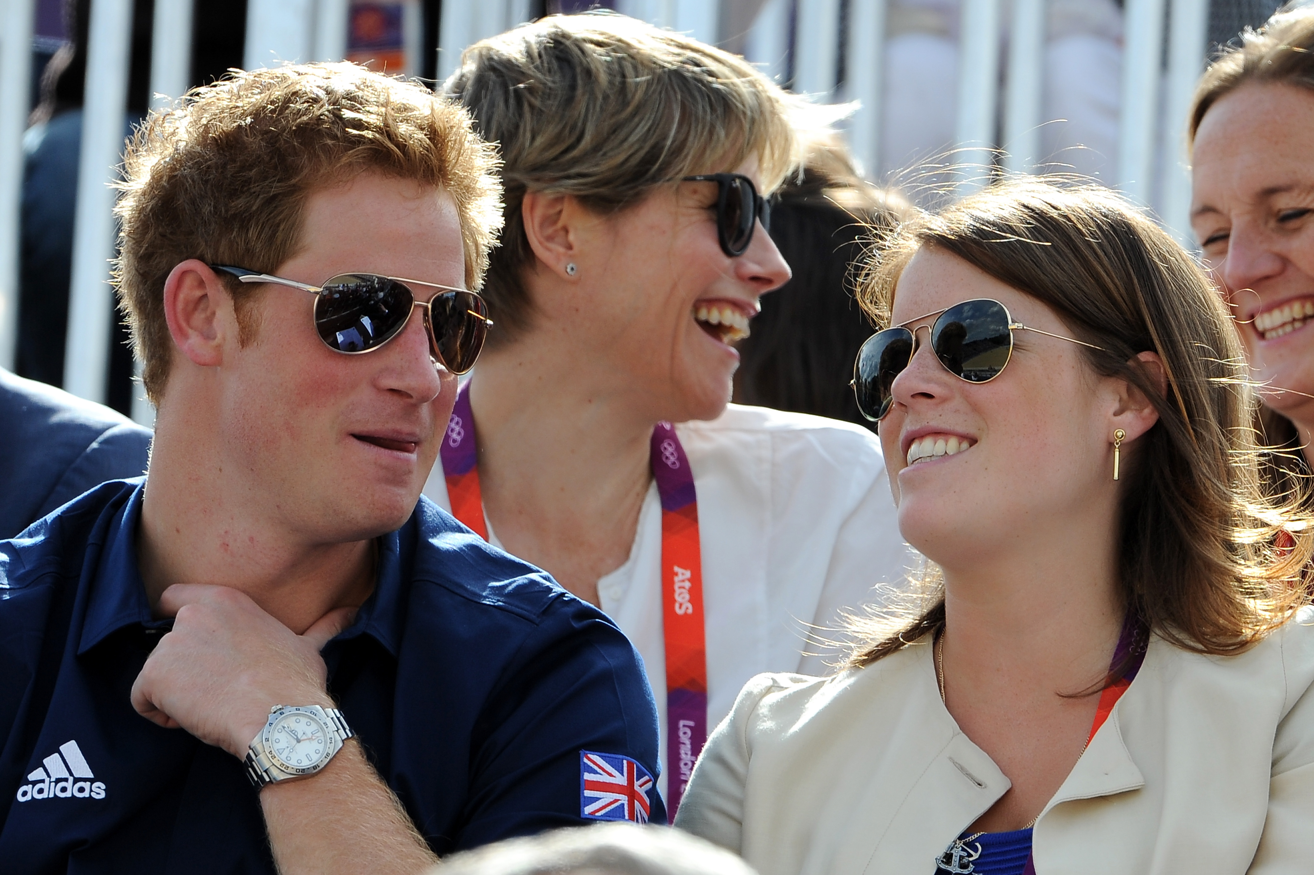 Prince Harry and Princess Eugenie sitting together and smiling at the Eventing Cross Country Equestrian event