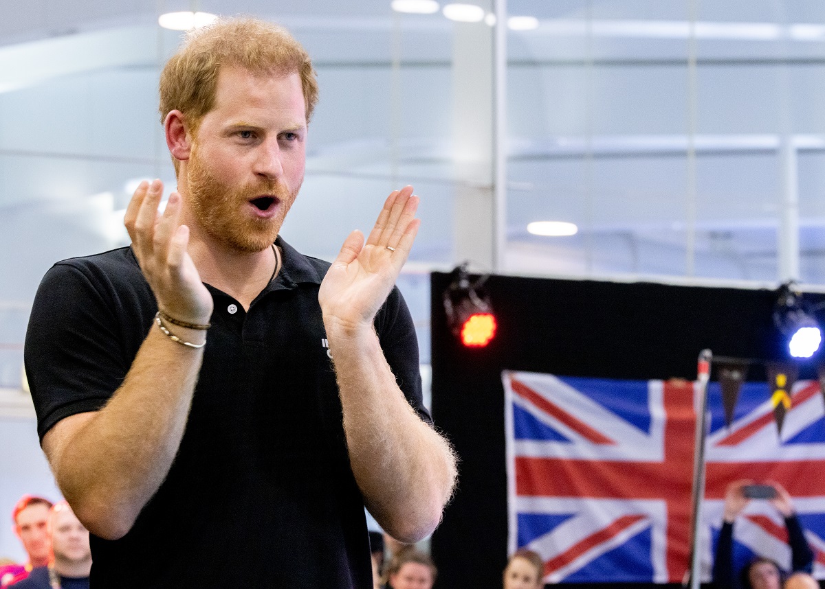 Prince Harry cheering at swimming finals during Invictus Games