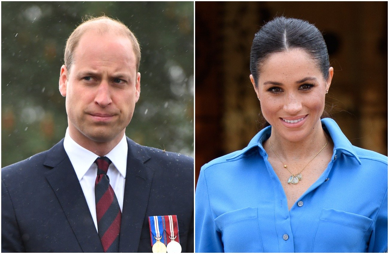 Prince William wearing a suit and looking to the right of the photo, Meghan Markle wearing a blue outfit and looking at the camera