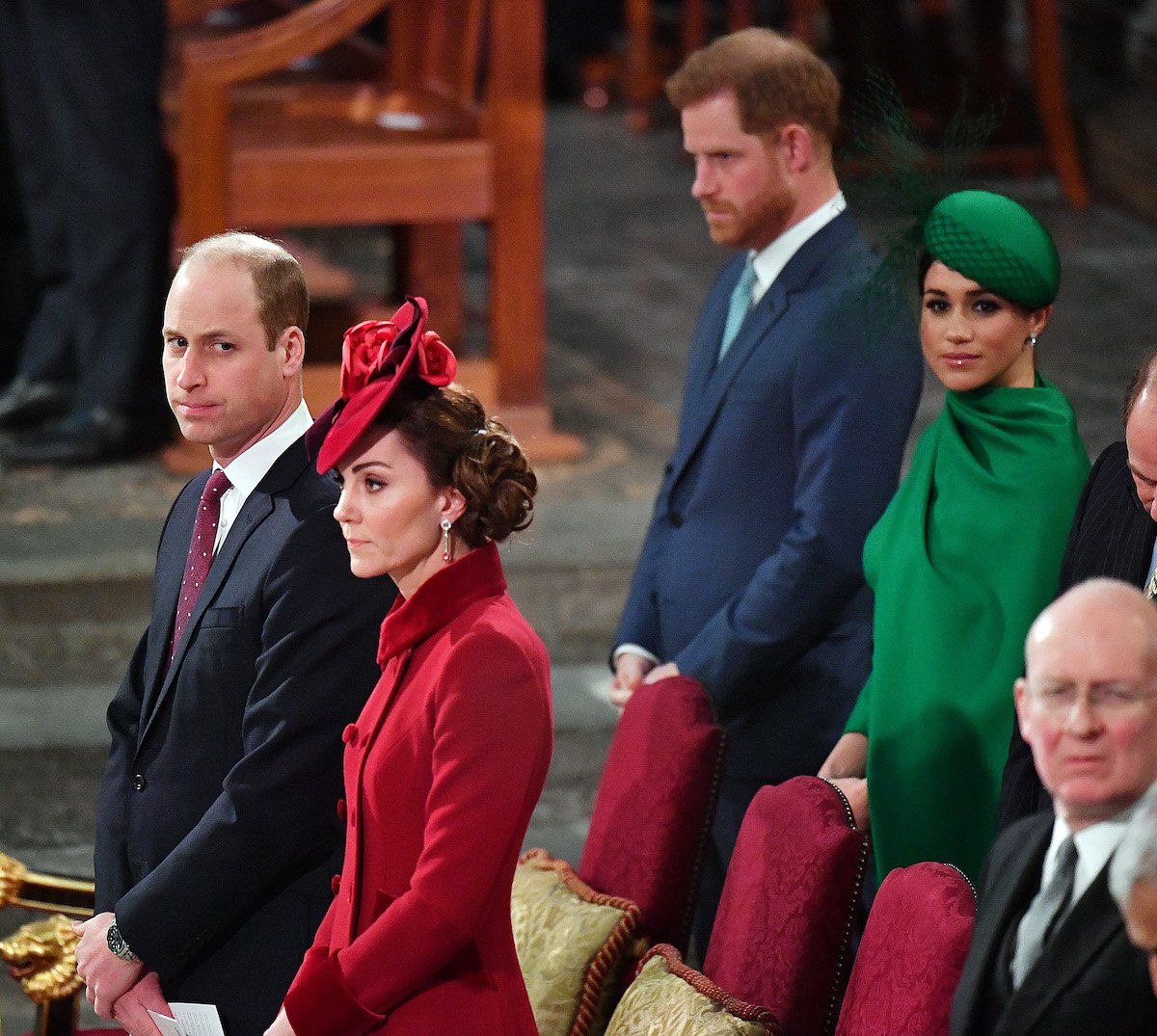 Prince William and Prince Harry sit one row apart with Kate Middleton and Meghan Markle
