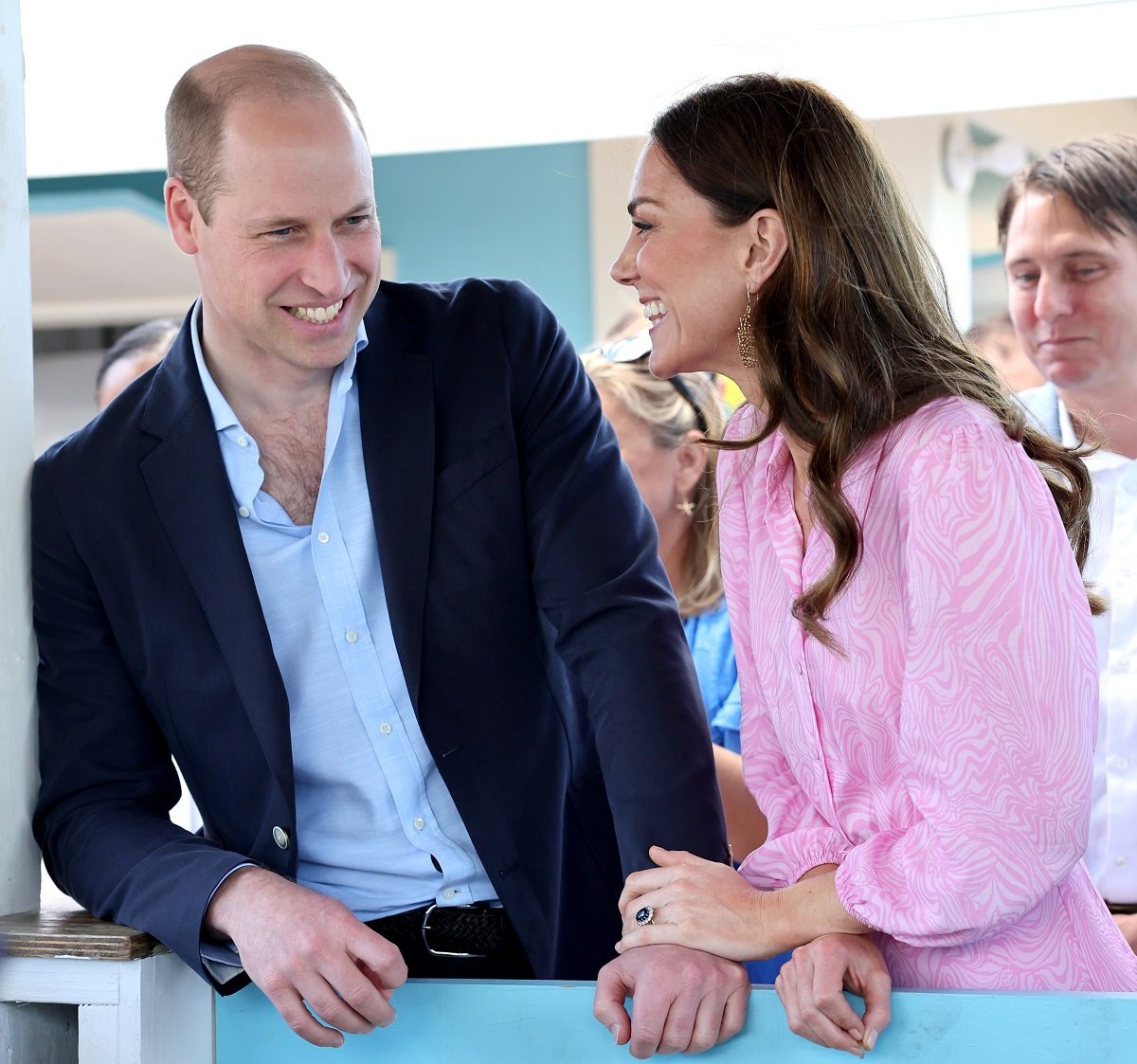 Prince William and Kate Middleton showed some PDA with the duchess resting her hand on the duke's during a visit to Abaco