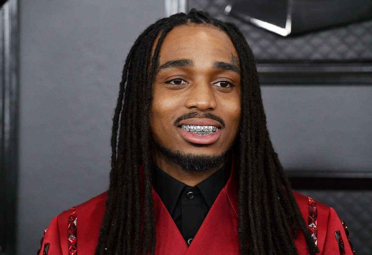 Quavo wearing red and smiling