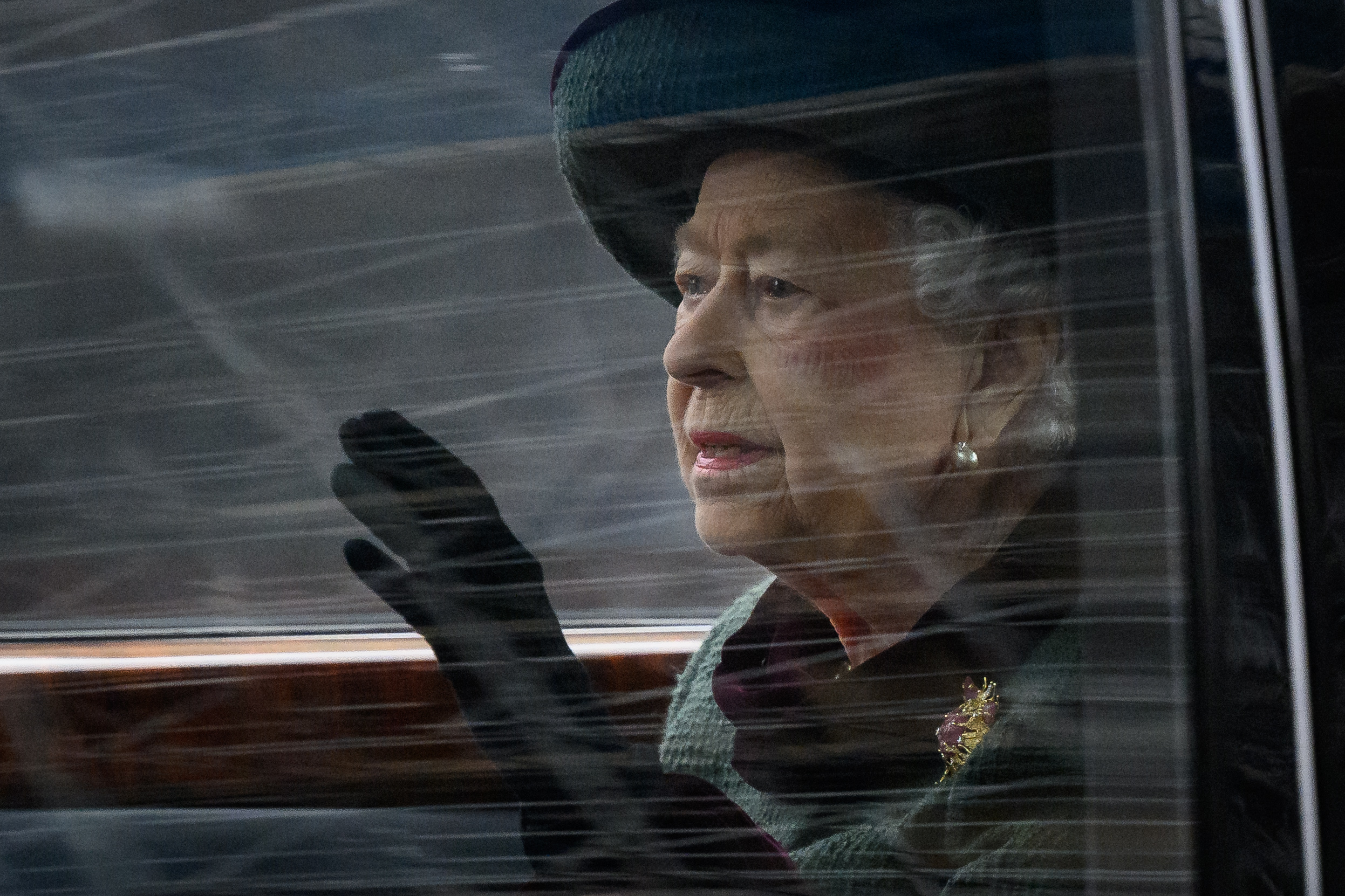Queen Elizabeth II, who wants to be closer to her late husband on her birthday, waves to crowd as she leaves Prince Philip's memorial service