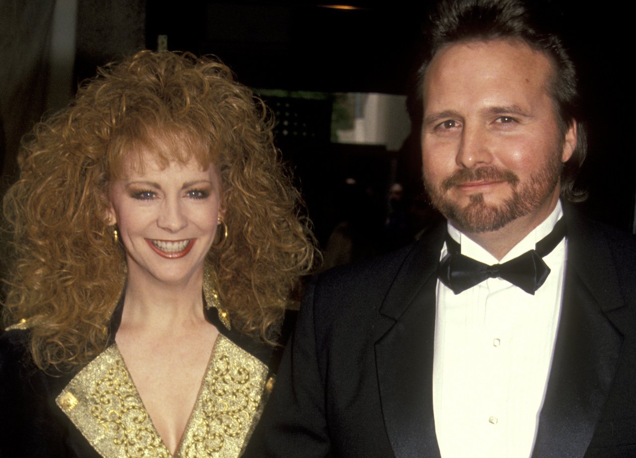 Reba McEntire and Narvel Blackstock pose together for a picture c. 1991