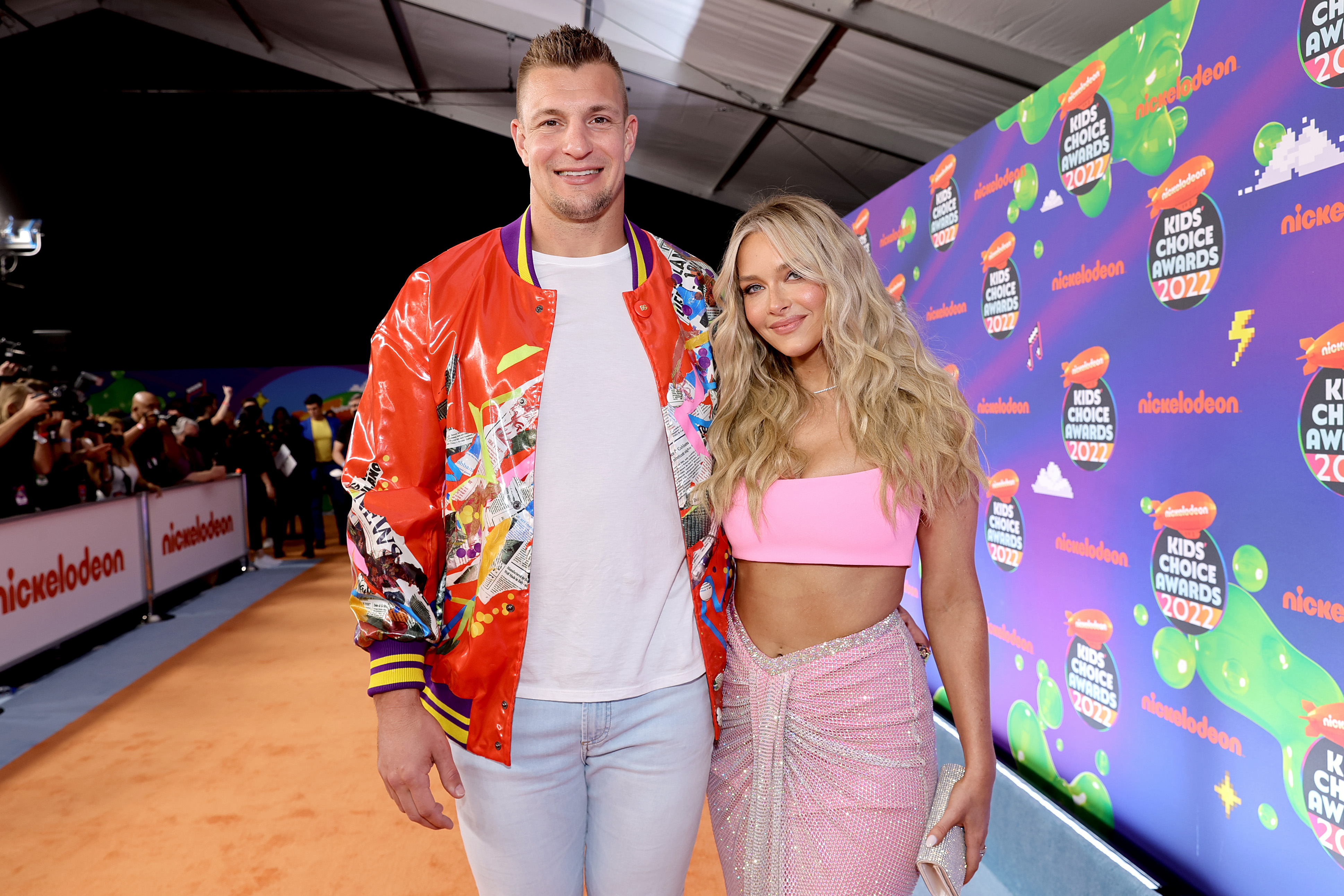 Rob Gronkowski, who is just a little older than his girlfriend Camille Kostek, smile together on the red carpet the Nickelodeon's Kids' Choice Awards 2022
