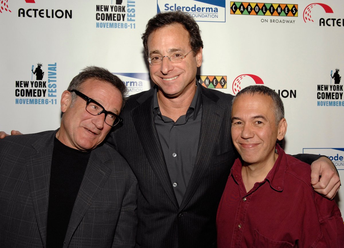 Robin Williams, Bob Saget, and Gilbert Gottfried pose together at an event.