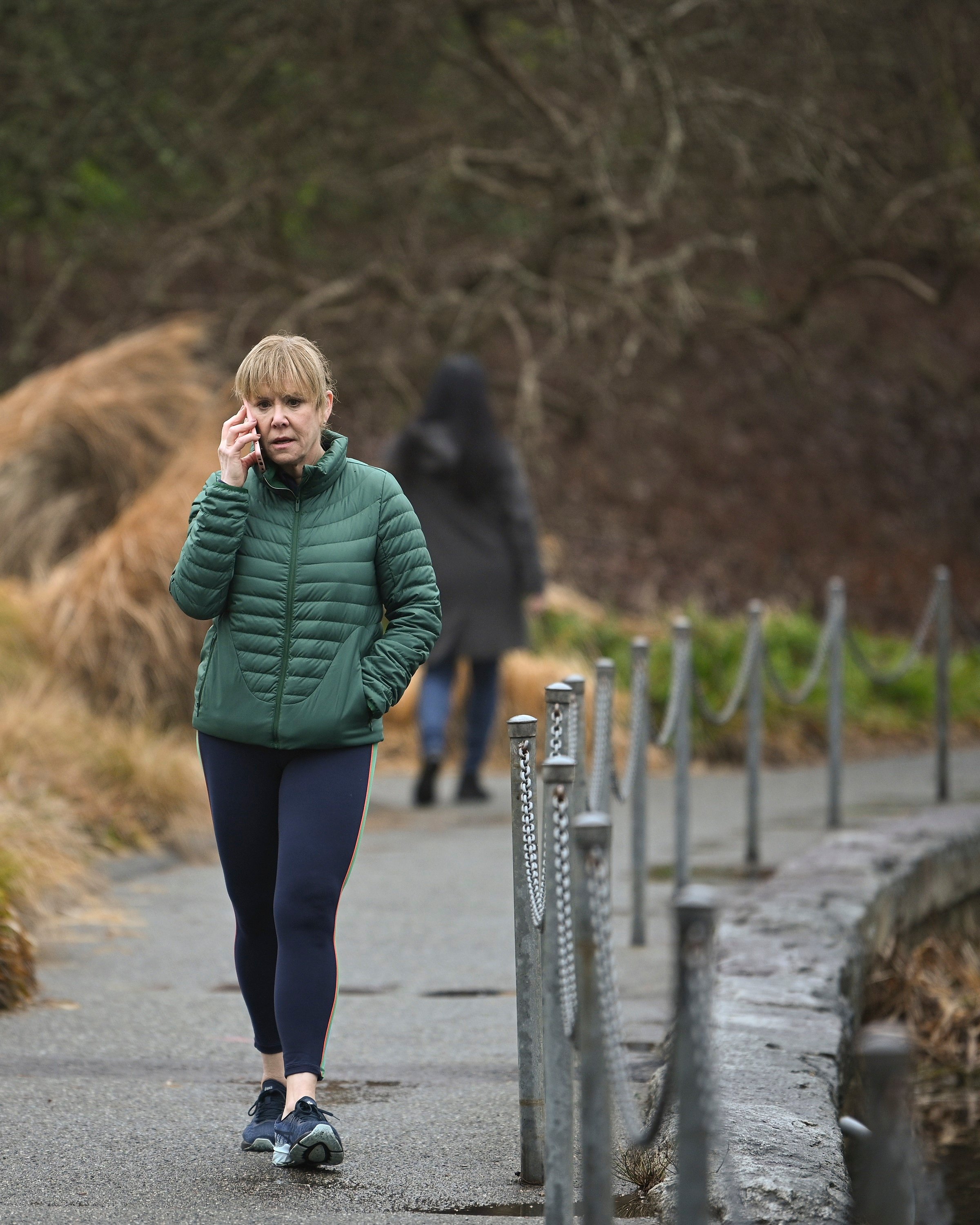 'A Million Little Things' Romy Rosemont as Shelly walking and talking on the phone