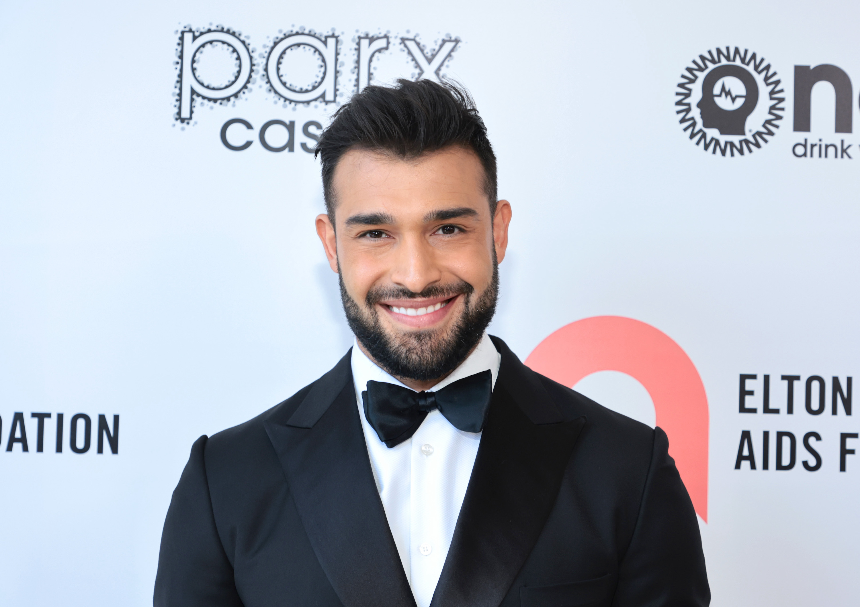 Sam Asghari smiling for the camera