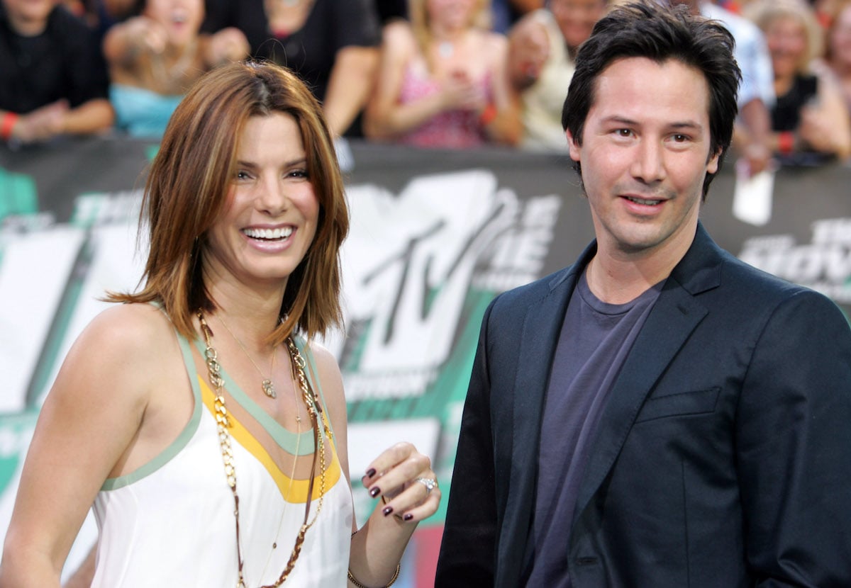 Sandra Bullock and Keanu Reeves smiling