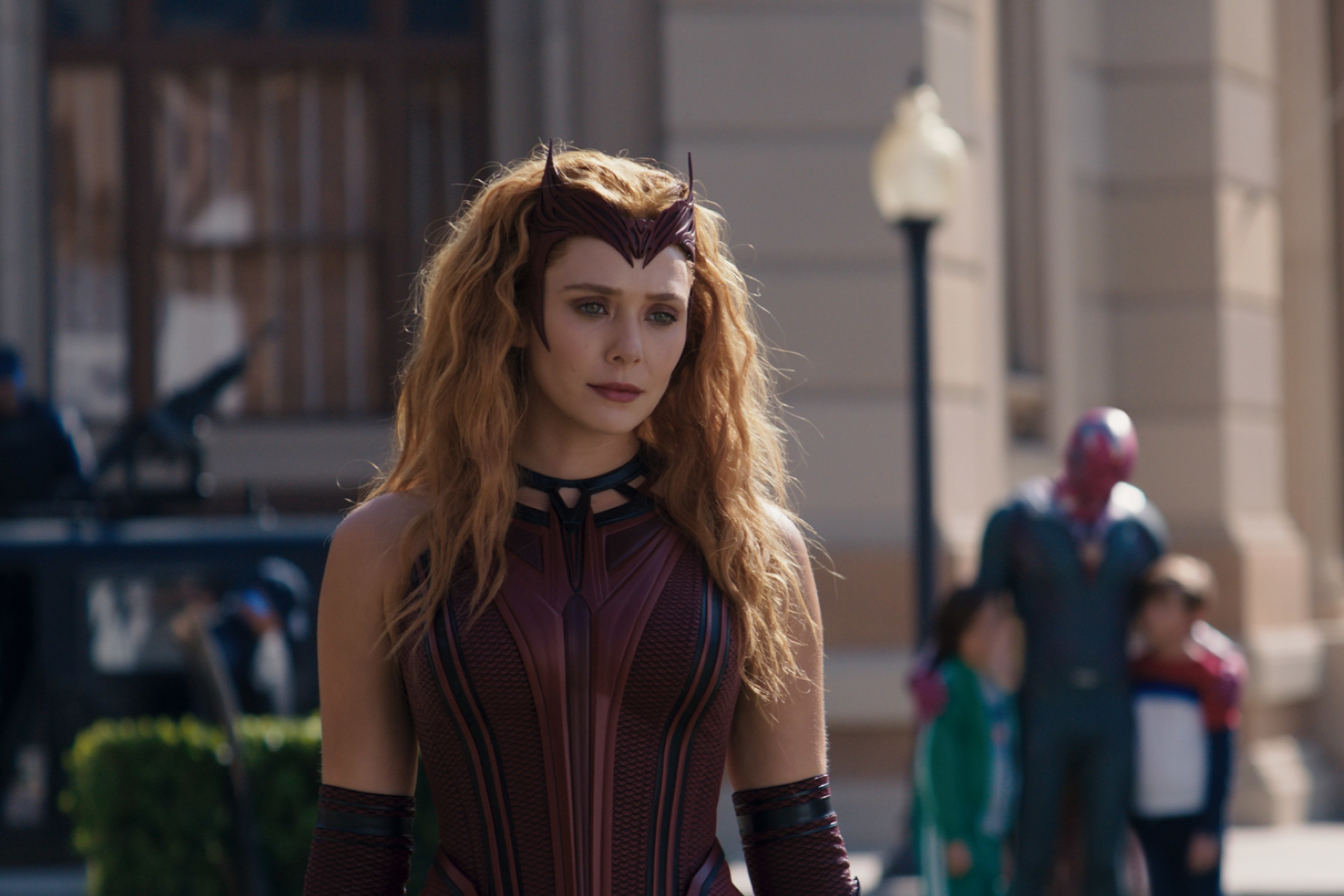 Elizabeth Olsen, who plays Scarlet Witch in 'Doctor Strange 2,' wears her maroon Scarlet Witch costume.