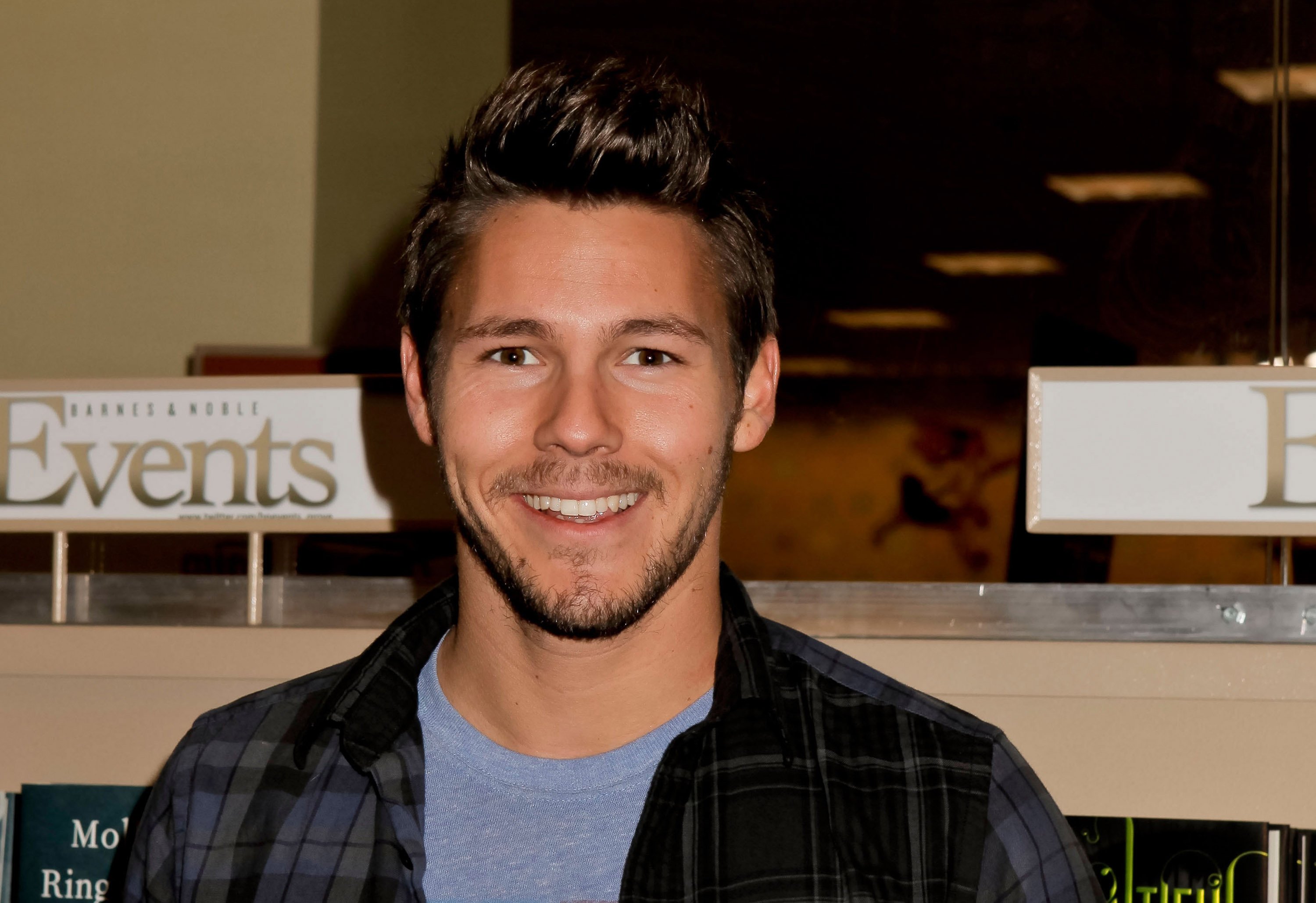 'The Bold and the Beautiful' actor Scott Clifton wearing a blue shirt and plaid jacket.