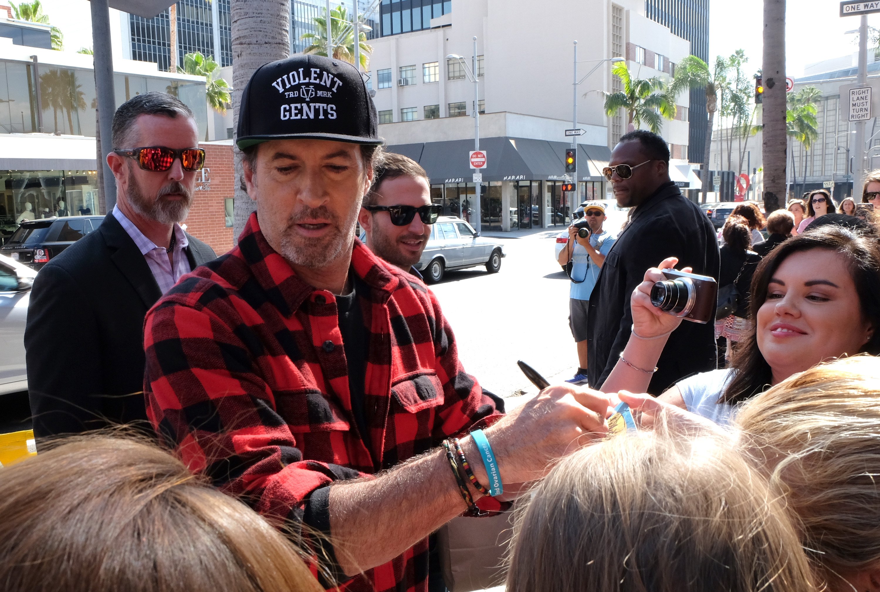 Scott Patterson signs autographs during a 'Gilmore Girls' pop up event in 2016