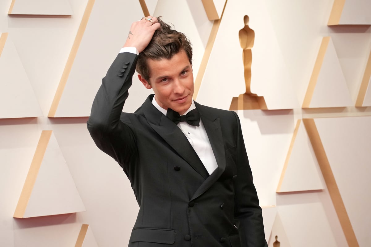 Shawn Mendes poses in a Tuxedo at the Oscar Awards in Hollywood, CA.