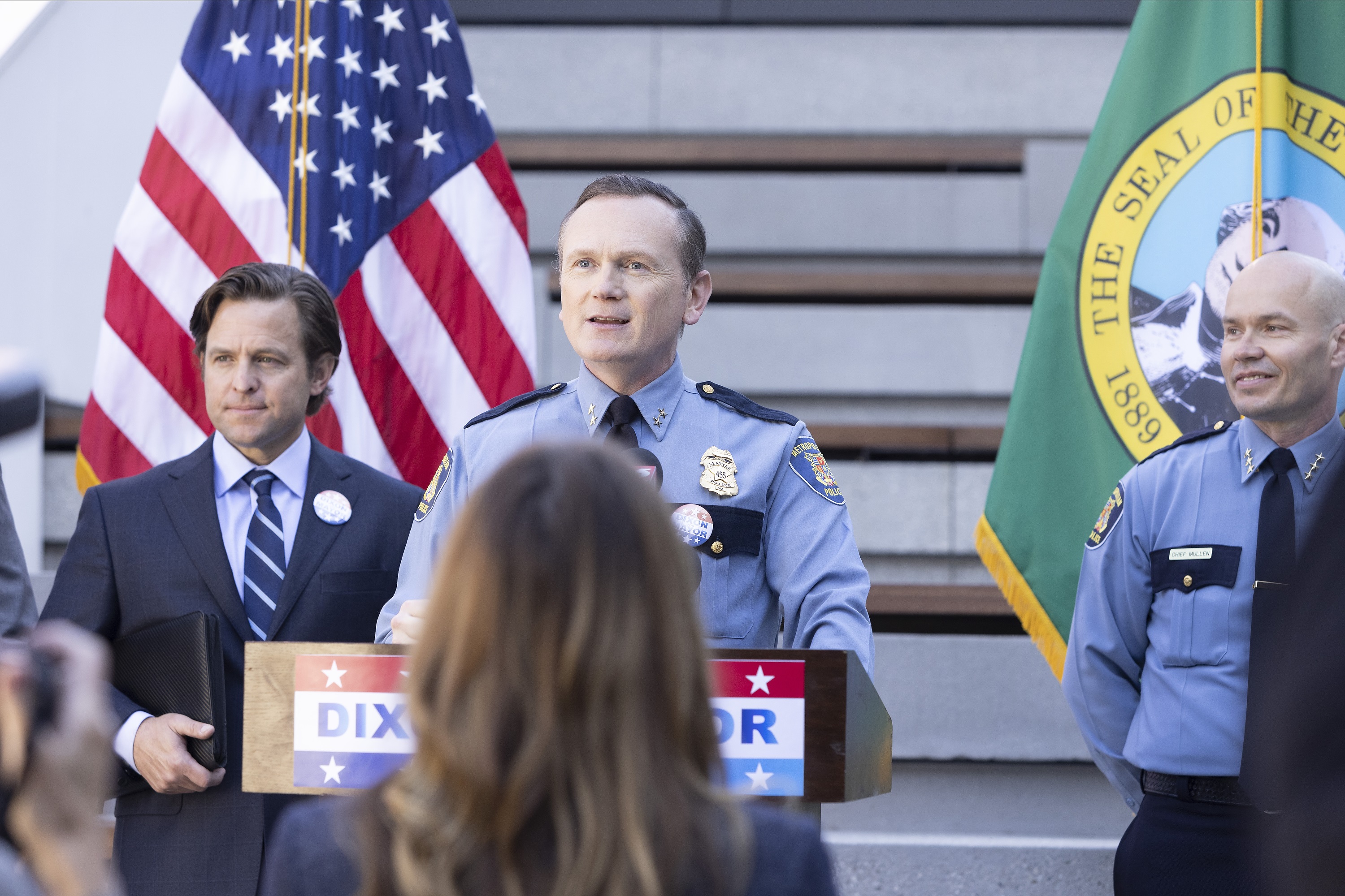 Pat Healy plays Michael Dixon standing at a podium in 'Station 19' Season 5 Episode 16