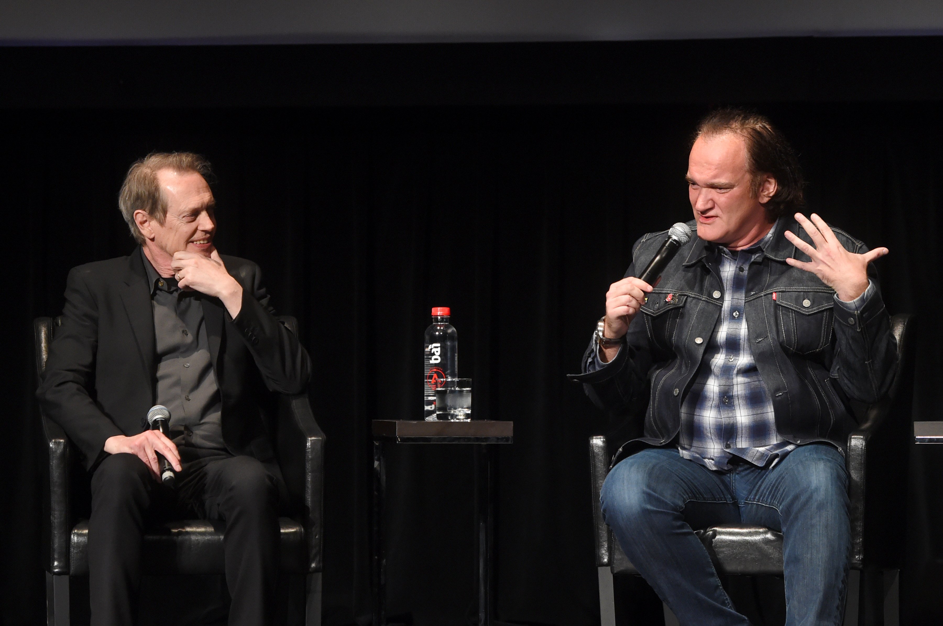 Steve Buscemi and Quentin Tarantino speak onstage at a 25th anniversary screening of the movie Reservoir Dogs