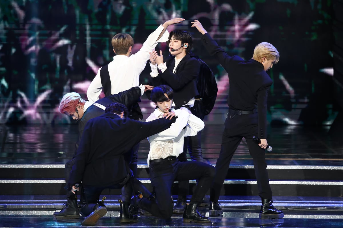 Wearing black and white outfits Stray Kids perform on stage at the Gaon Chart K-pop Awards in Seoul, South Korea.