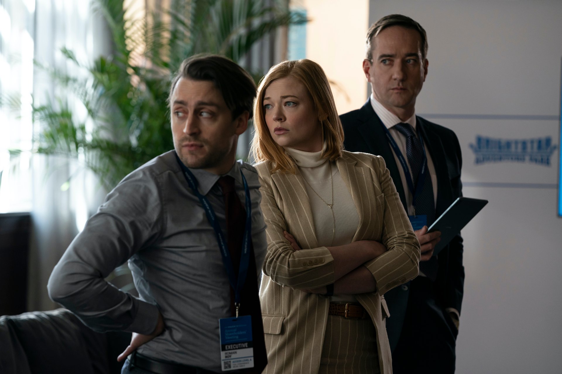 Kieran Culkin, Sarah Snook, and Matthew Macfadyen as Roman Roy, Shiv Roy, and Tom Wambsgans in 'Succession' Season 3. They're standing next to one another and looking at something to the left.