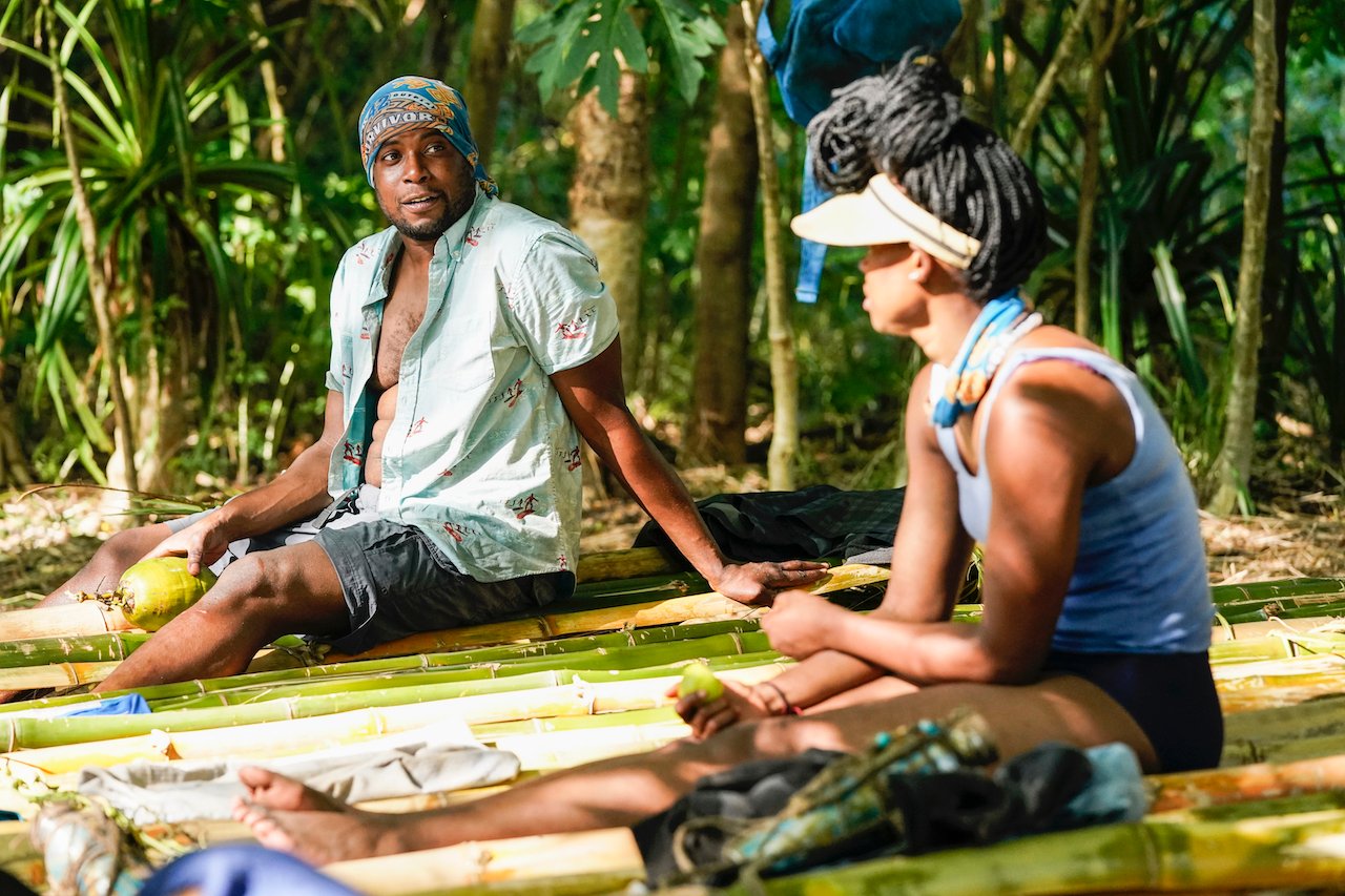 Rocksroy Bailey and Drea Wheeler sit together at camp on 'Survivor 42'.