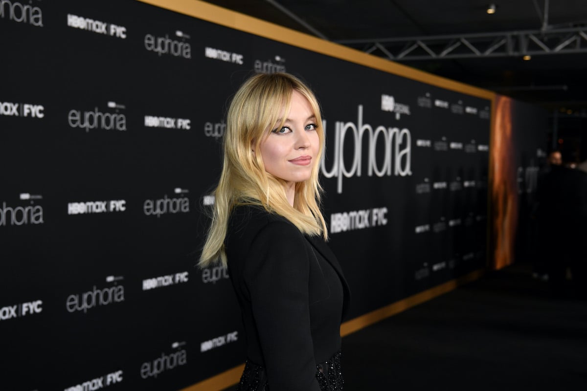 TV and movie star Sydney Sweeney wears all black and looks over her shoulder at the Euphoria FYC Event