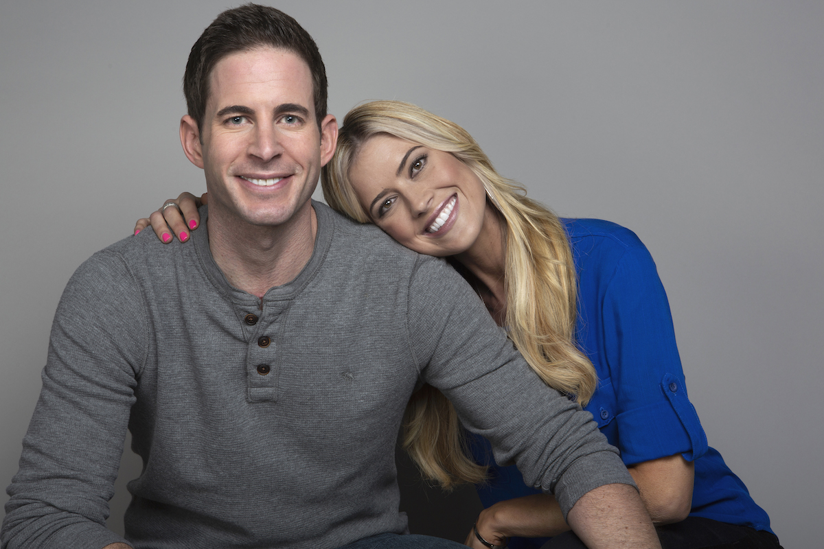 Tarek El Moussa and Christina Haack smile and pose together.