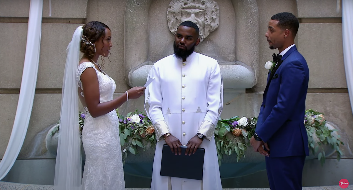 Taylor and Brandon standing in front of the minister on their wedding day on 'Married at First Sight' Season 10
