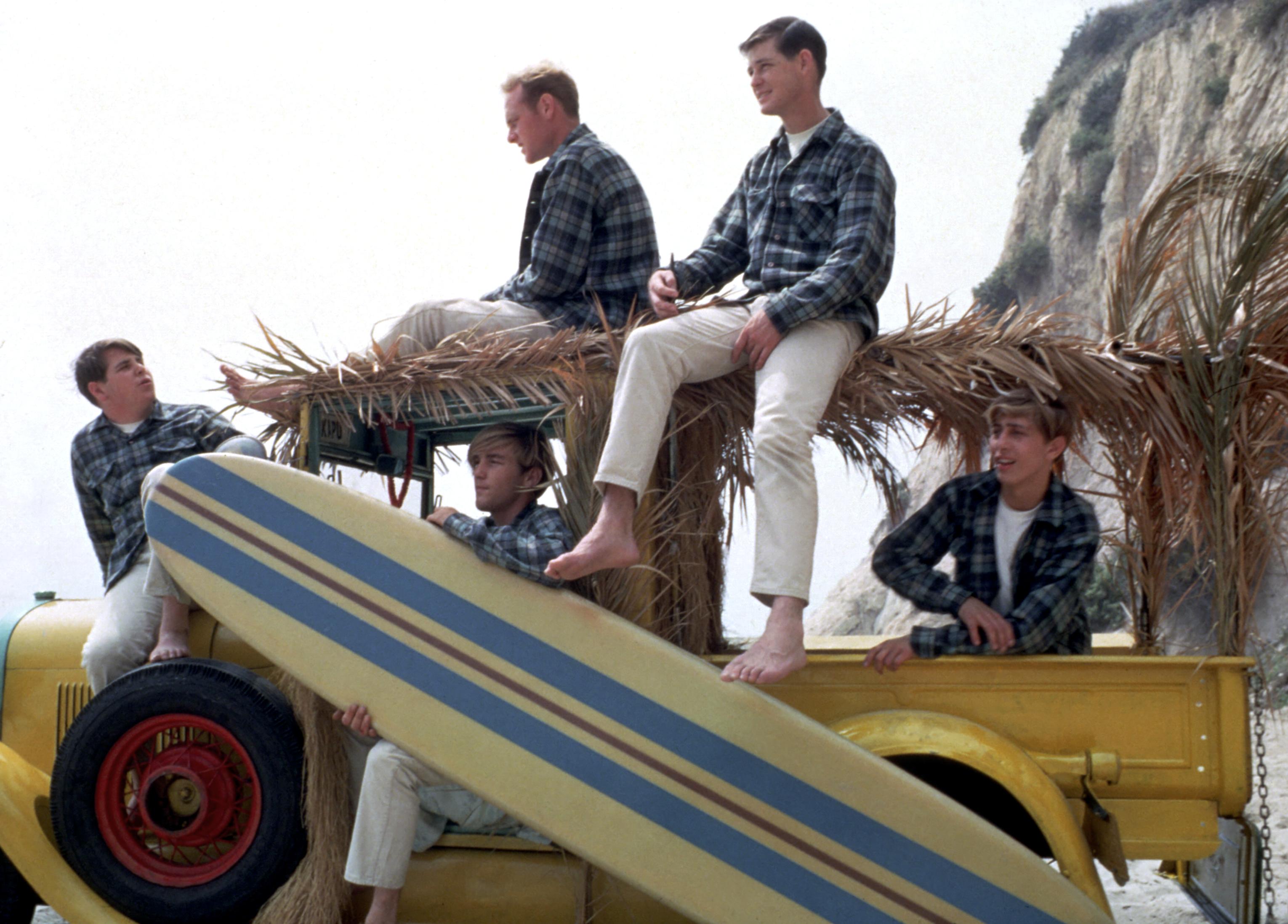The Beach Boys with a car