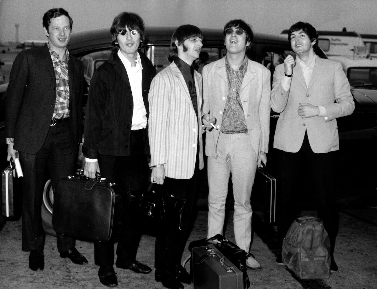 The Beatles and their manager, Brian Epstein, arriving at Heathrow Airport following a tour in 1966.