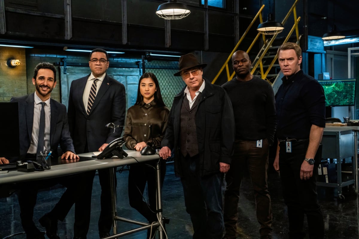 The cast of The Blacklist Season 9 Episode 15 look into the camera. Only Amir Arison is smiling.