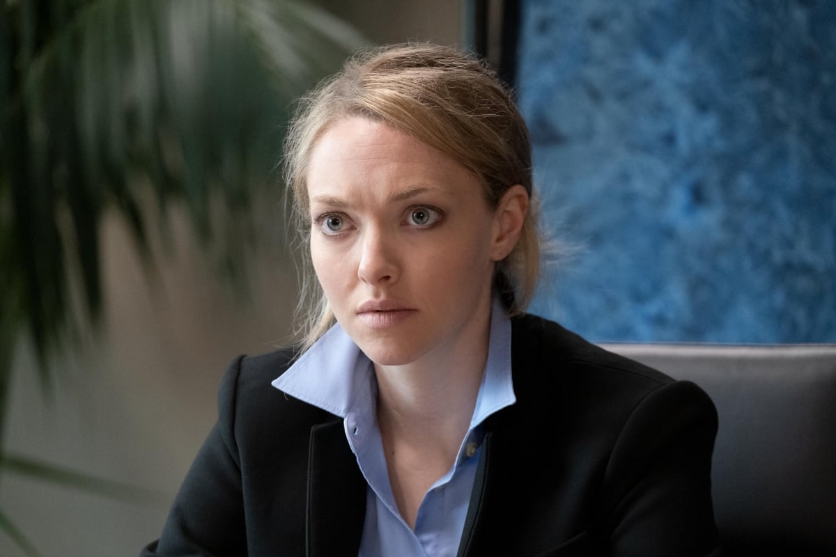 Amanda Seyfried as Elizabeth Holmes in The Dropout finale, wearing a blue collared shirt and black blazer.
