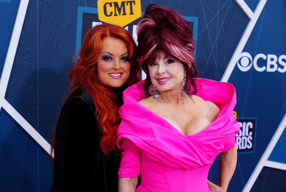 Wynonna Judd and Naomi Judd pose on the red carpet of the CMT Music Awards in Nashville, TN.