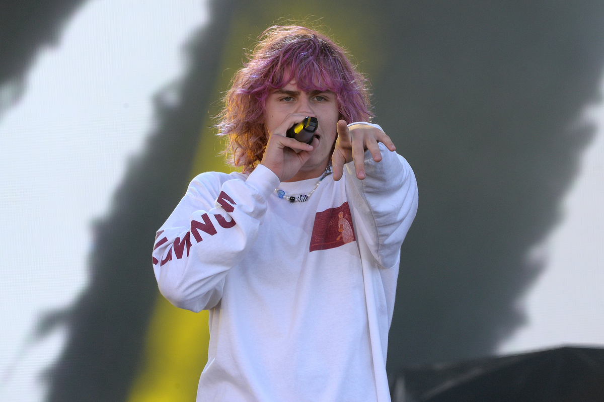 With newly dyed purple hair, The Kid Laroi performs on stage in New Orleans, LA.