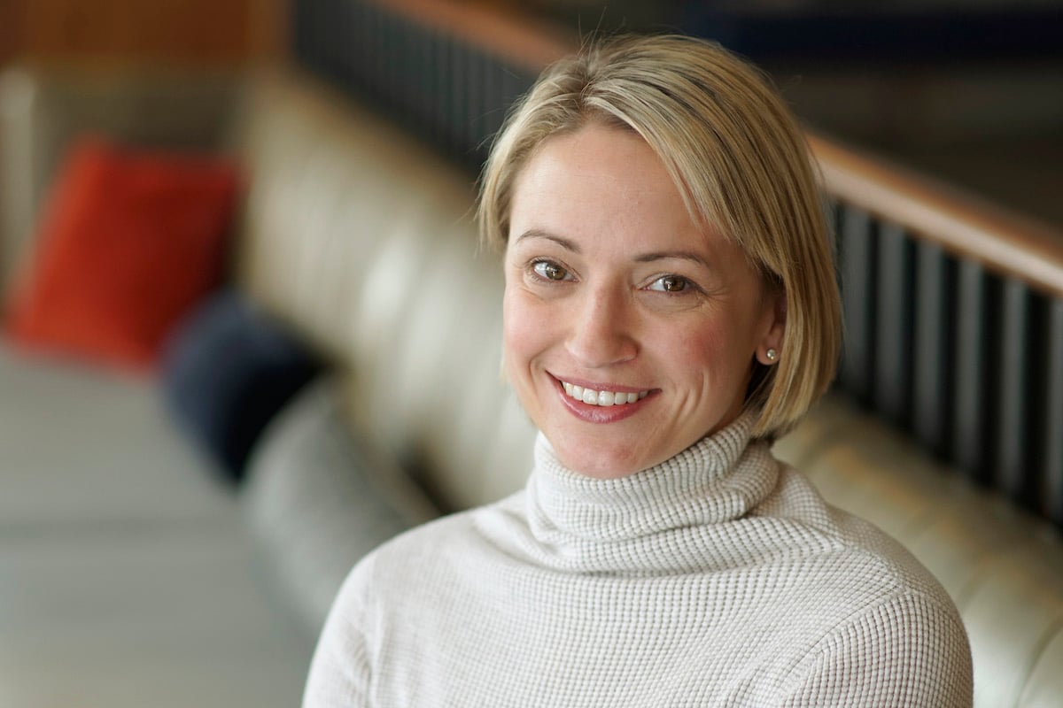 Erin French, of 'The Lost Kitchen' and Dad's Meatloaf, smiles wearing a white turtleneck