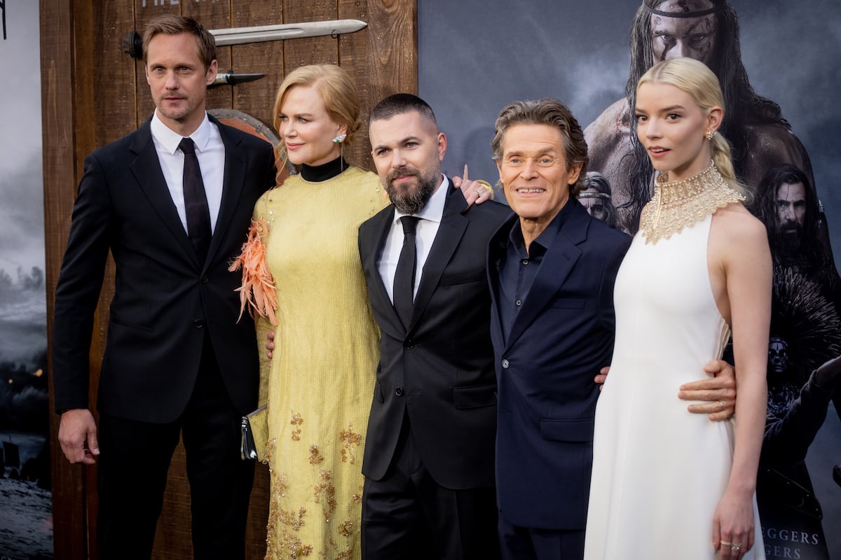 ‘The Northman’ stars Alexander Skarsgård, Nicole Kidman, director Robert Eggers, Willem Dafoe, and Anya Taylor-Joy embrace and pose on the red carpet