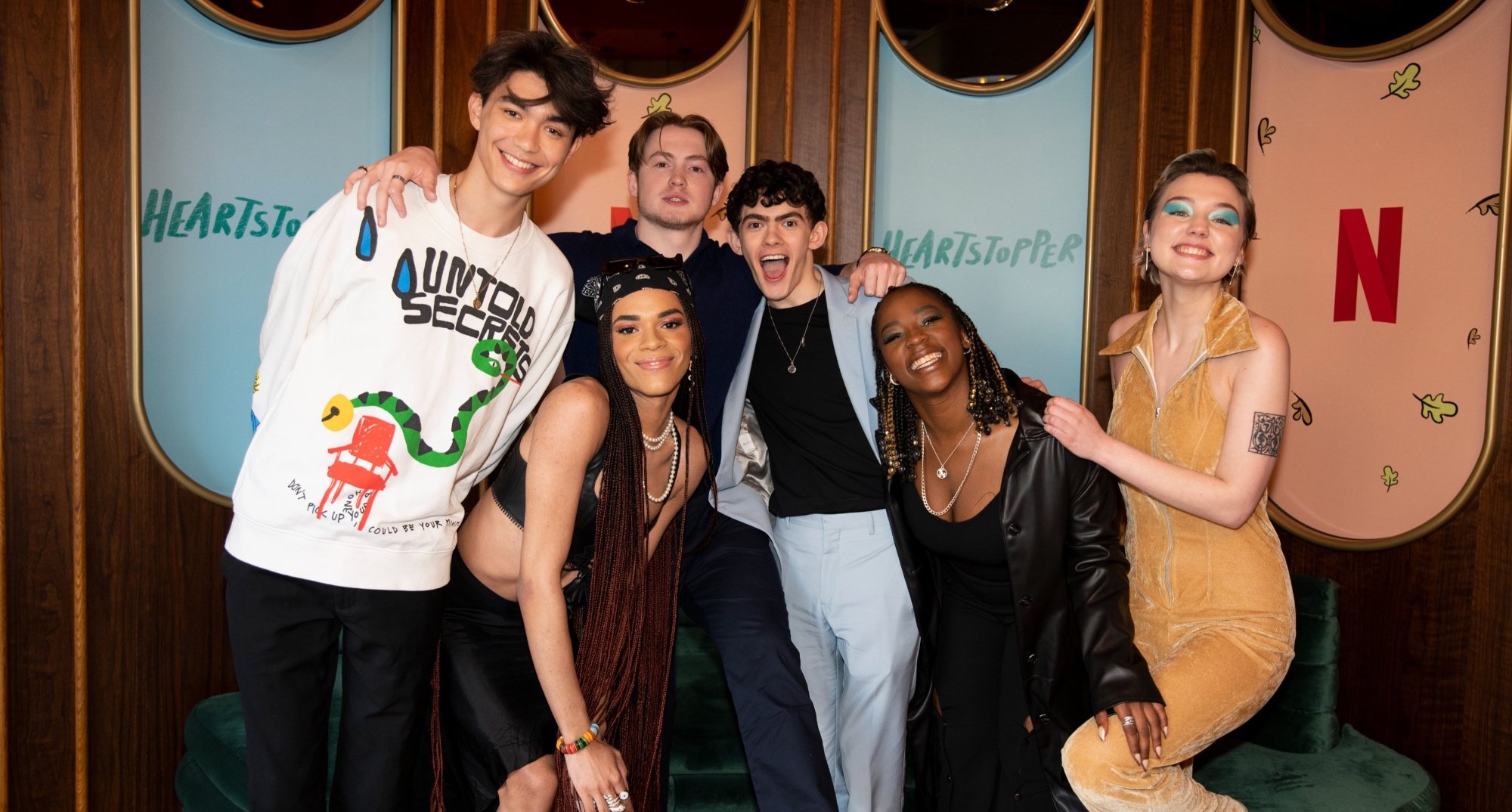 The cast of 'Heartstopper' posing at Netflix event.