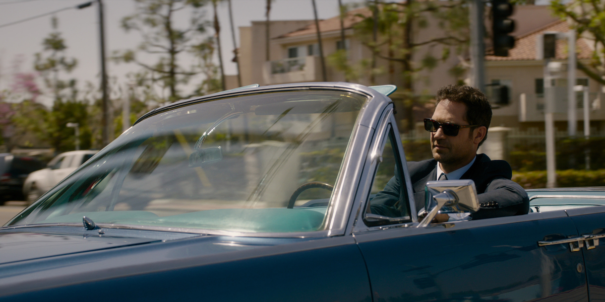 Manuel Garcia-Rulfo as Mickey Haller in a convertible in Netflix's 'The Lincoln Lawyer' 