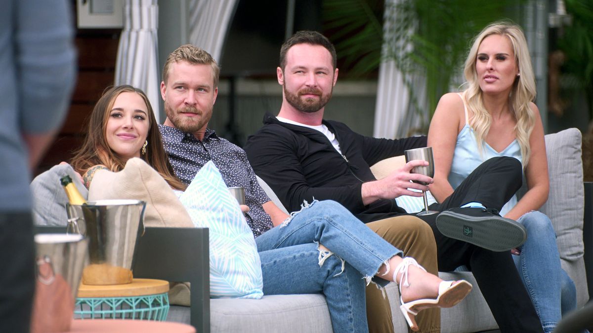 The Ultimatum couples Hunter, Alexis, Lauren and Nate all sit next to each other on a bench.