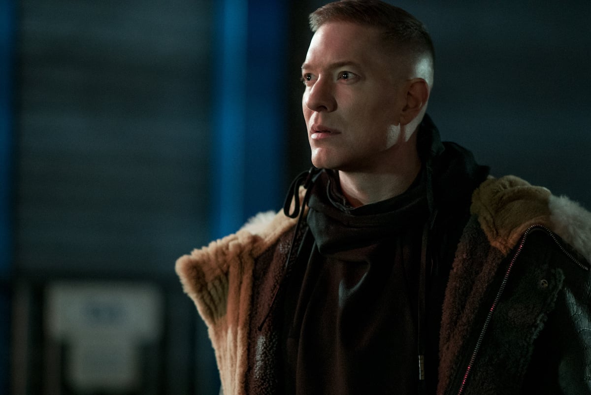 Joseph Sikora dresses as his 'Power Book IV: Force' character Tommy Egan wearing a black hoodie with a fur coat