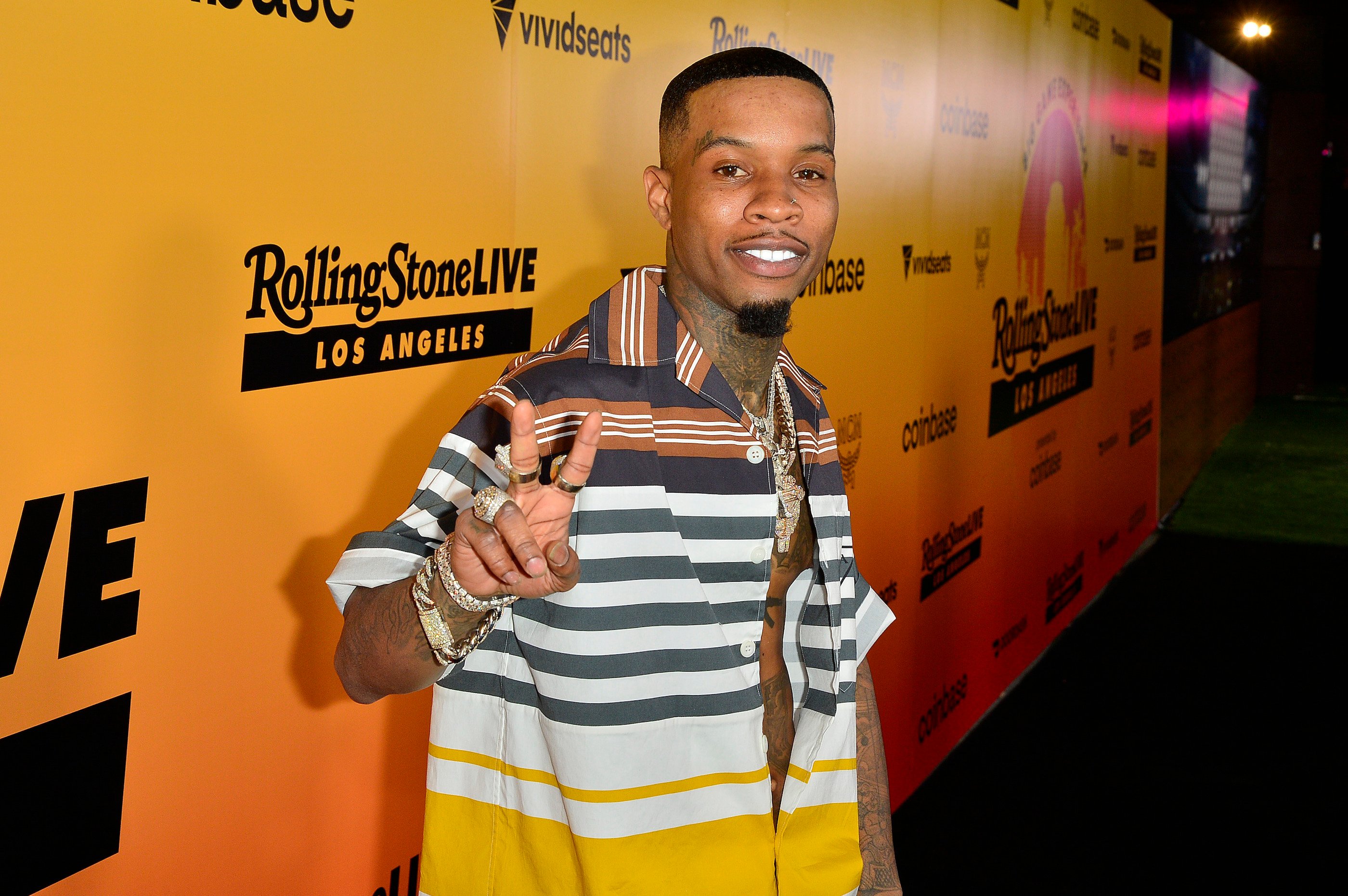 Tory Lanez wearing a striped shirt