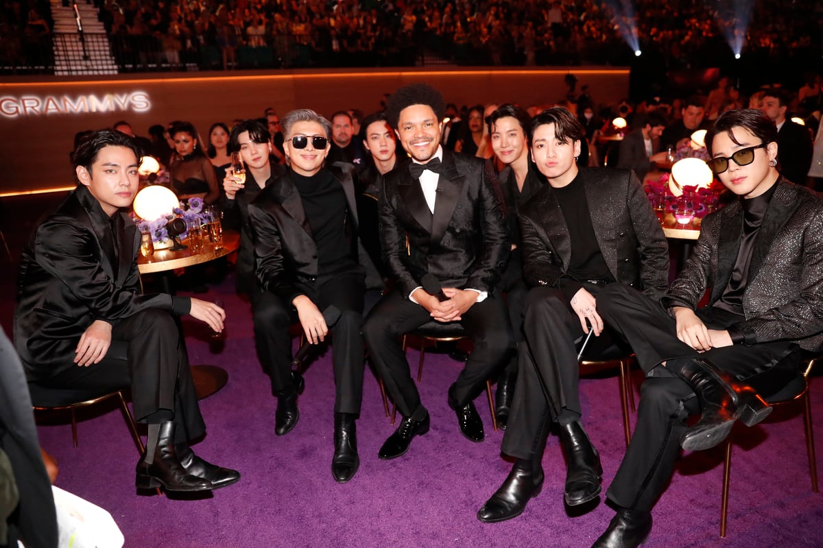 Trevor Noah sits in the middle of BTS for a segment at the 64th Annual Grammy Awards in Las Vegas, NV.