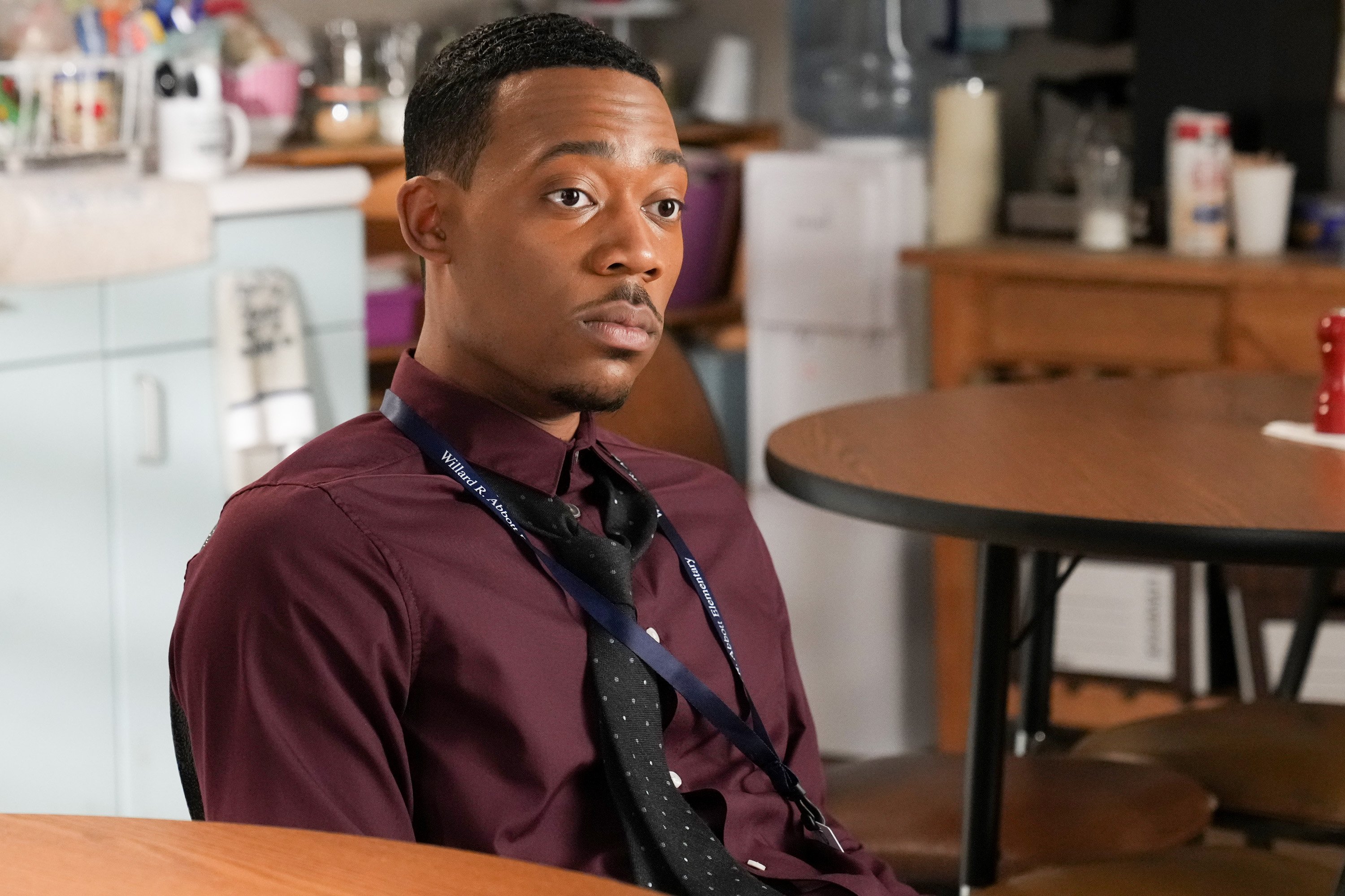 Tyler James Williams as Gregory Eddie sitting down in 'Abbott Elementary'