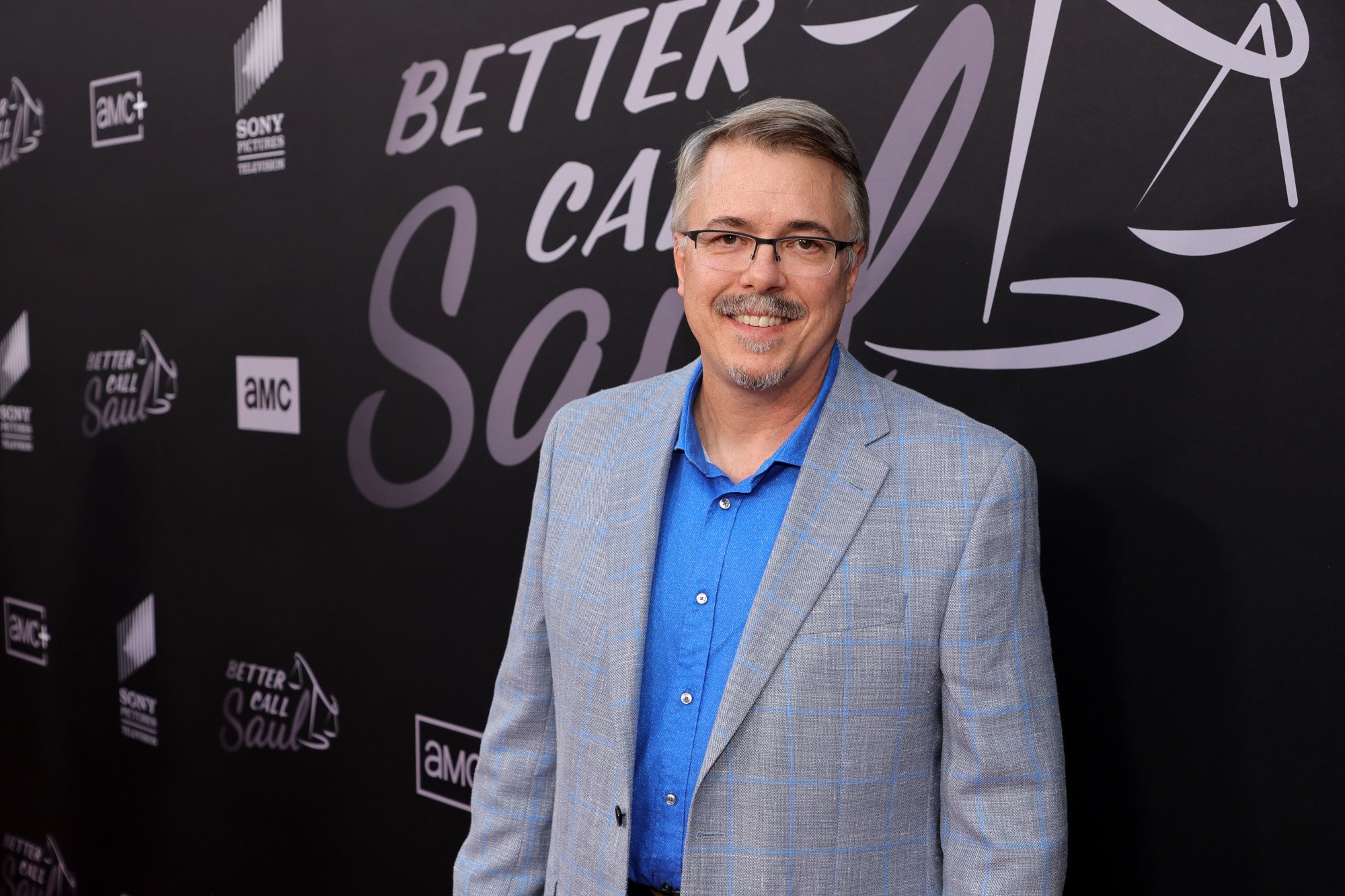 'Breaking Bad' and 'Better Call Saul' creator Vince Gilligan. He's wearing a grey suit and walking the red carpet for the 'Better Call Saul' Season 6 premiere.