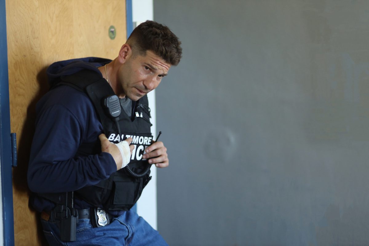 Jon Bernthal as Wayne Jenkins hunching over in a bullet proof vest in 'We Own This City'