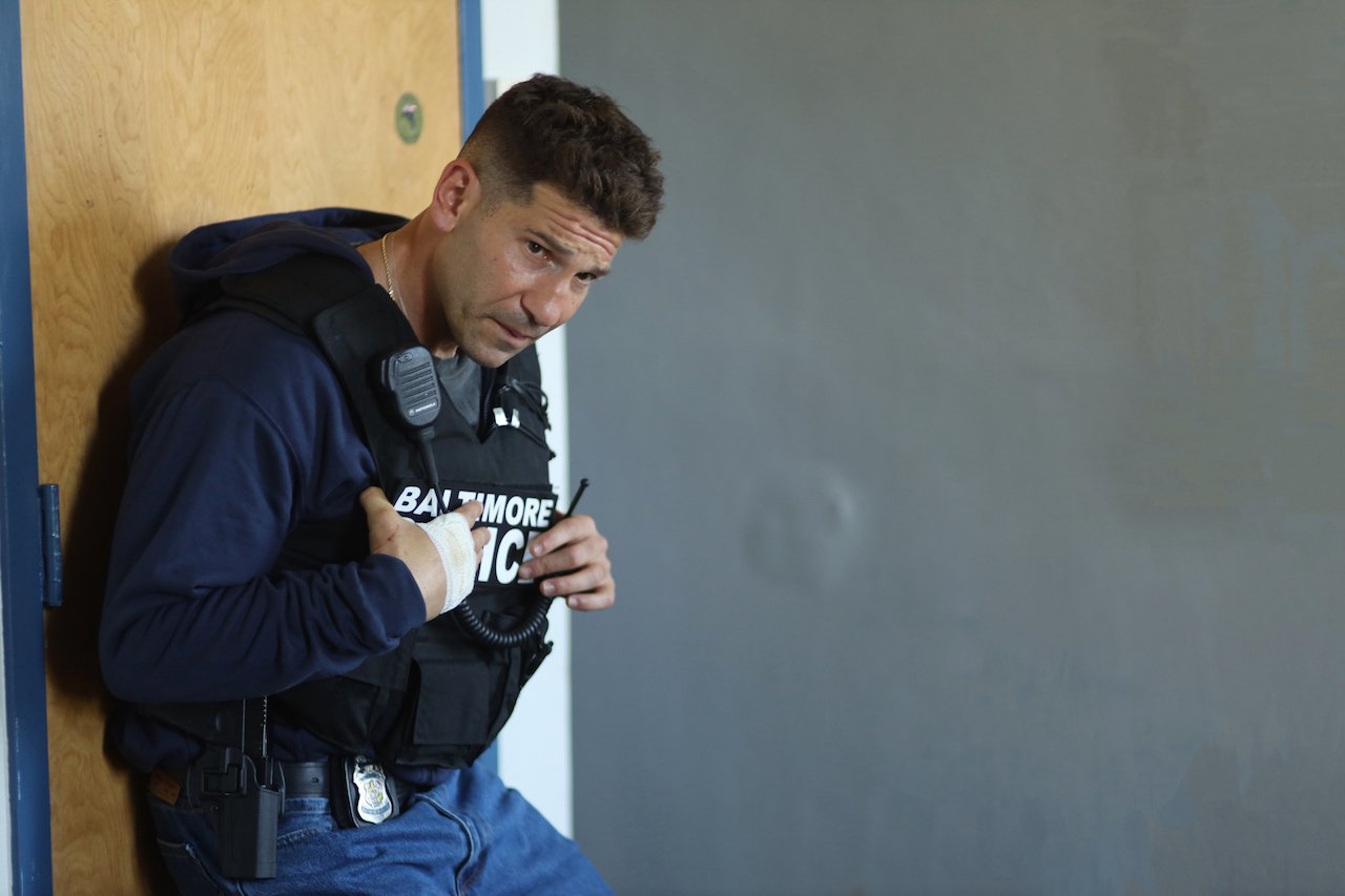 Jon Bernthal as Sgt. Wayne Jenkins stands outside a door in 'We Own This City'.'We Own This City' release date is scheduled for April 25. 