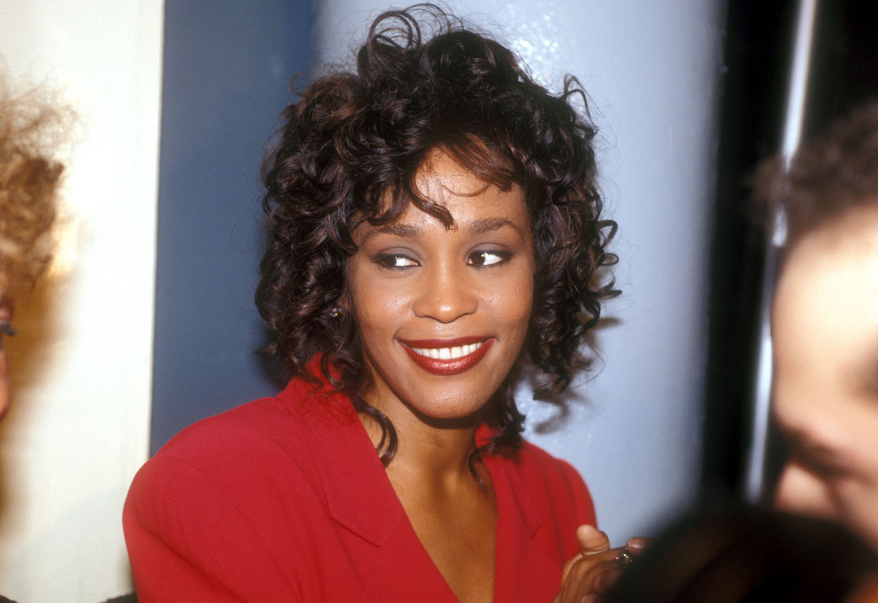 Whitney Houston smiles for photo - Houston's former guest home is now up for sale