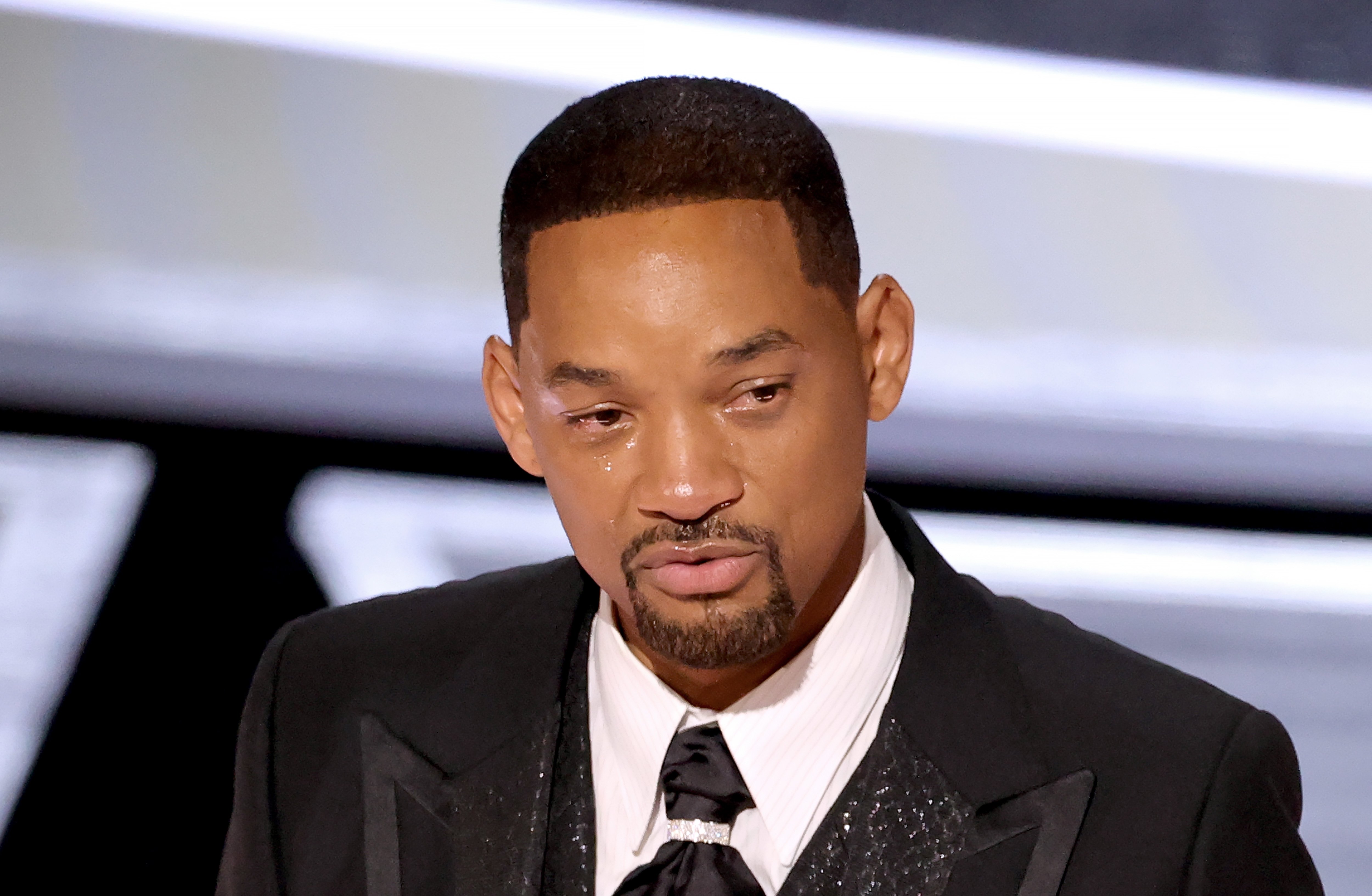 Will Smith with tears in his eyes as he accepts the Oscar for Best Actor at the 2022 Academy Awards 