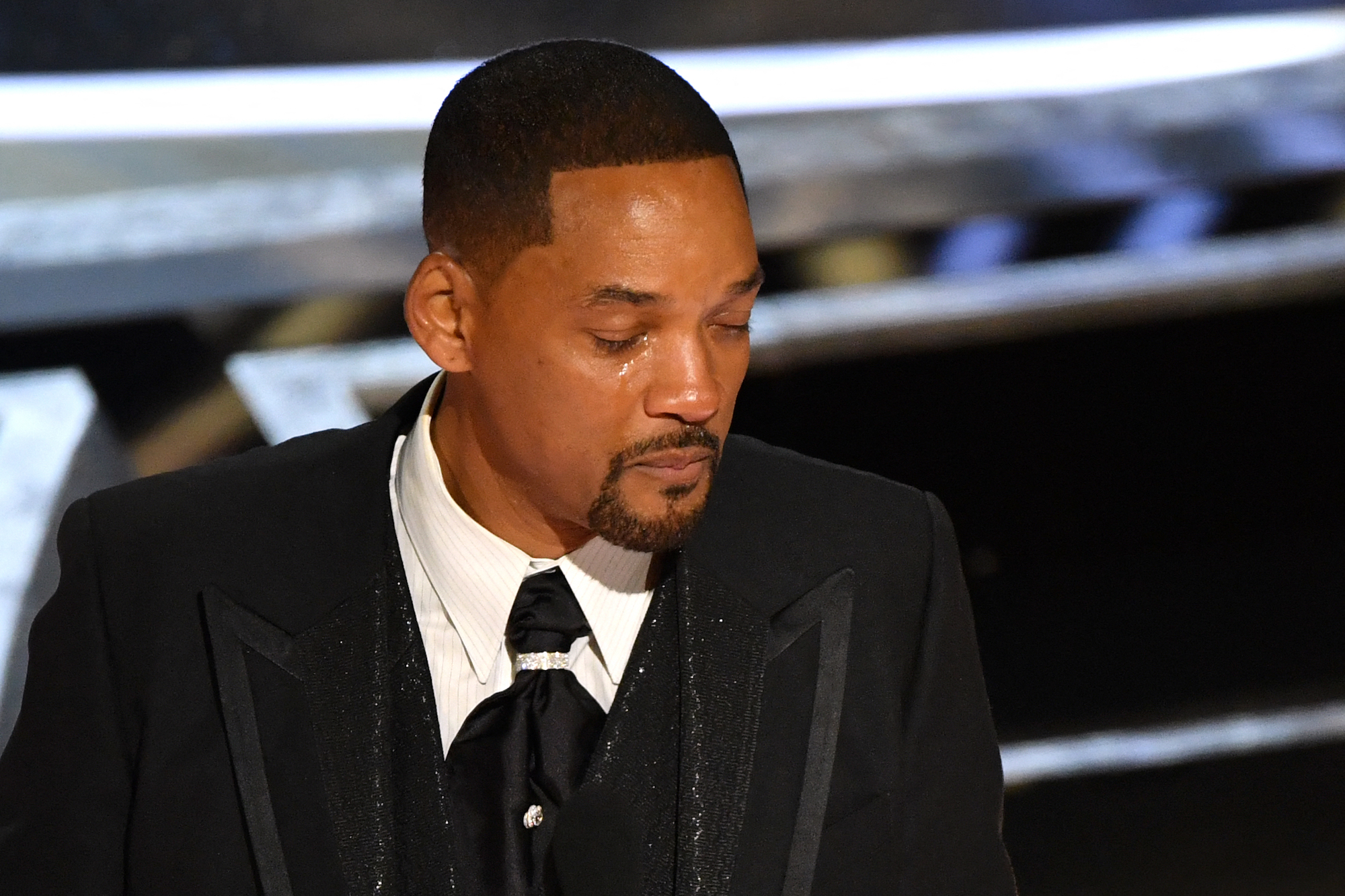 Will Smith cries as he accepts the Oscar after slapping Chris Rock