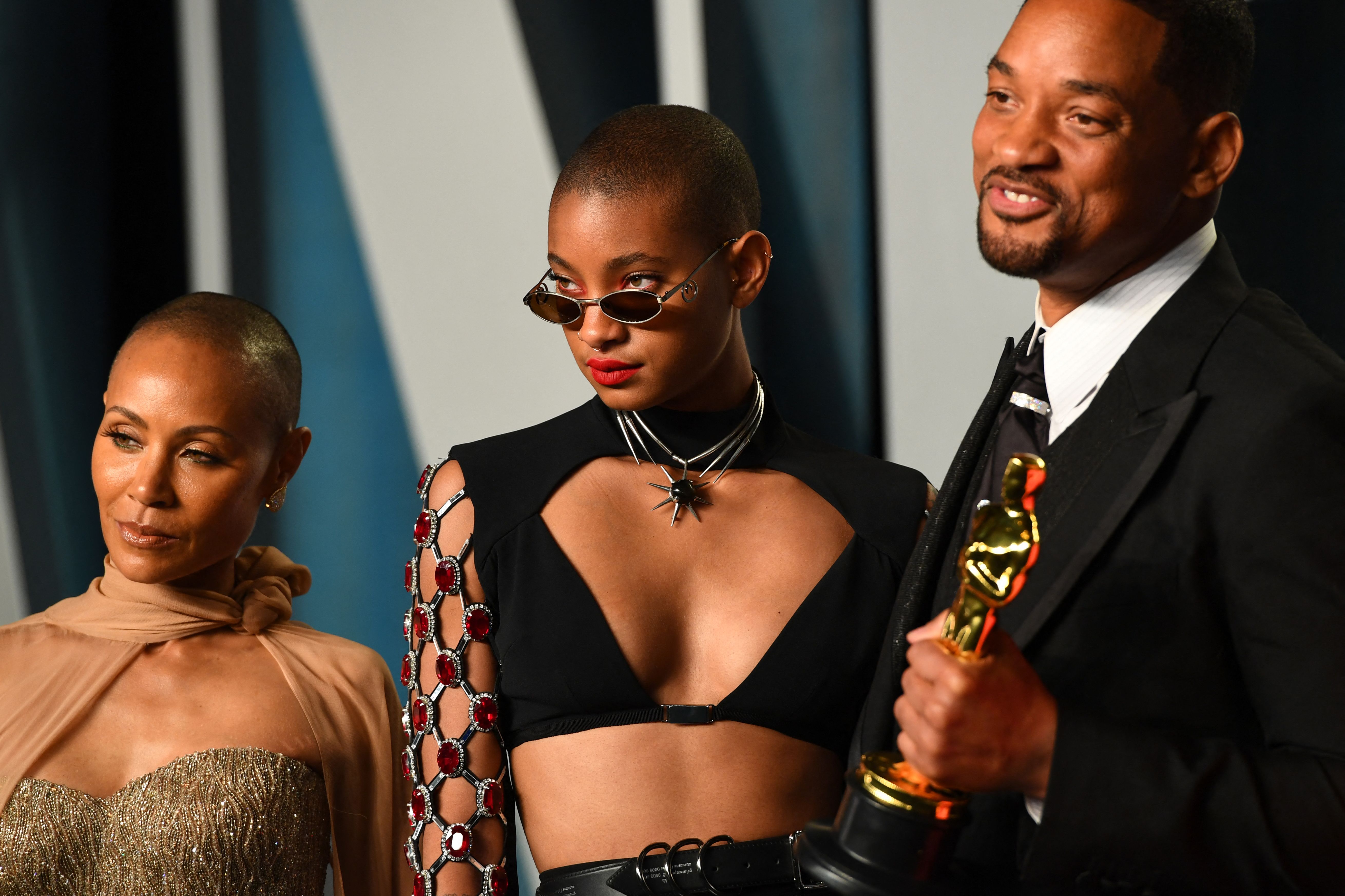 Will Smith, whose family was called out by Kodak Black, poses with his wife, Jada Pinkett Smith, and their daughter, Willow Smith, at 2022 Vanity Fair Oscar Party