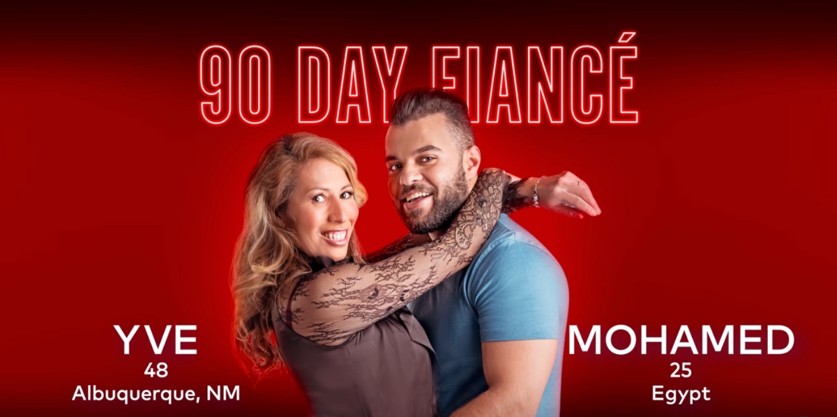 Yve and Mohamed pose together in front of red background for '90 Day Fiancé' Season 9 promo.